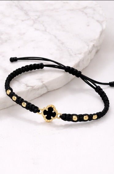 Manilla Trébol · Hilo negro + oro 18k