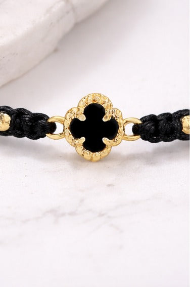 Manilla Trébol · Hilo negro + oro 18k