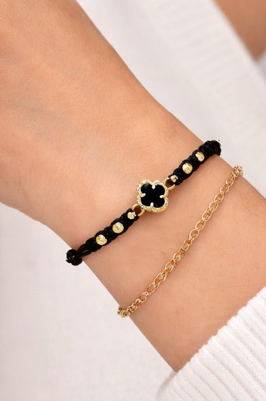 Manilla Trébol · Hilo negro + oro 18k