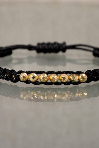 Manilla Oro · Hilo negro trenzado + bolas de oro laminado 18k